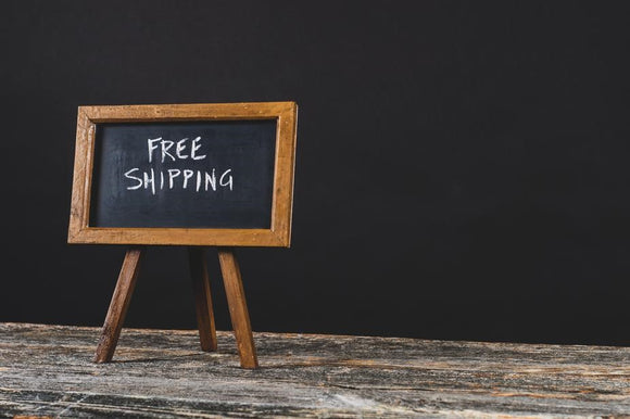 blackboard sign that reads free shipping